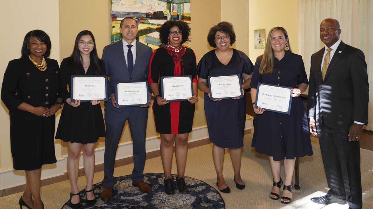 Renetta Garrison Tull, vice chancellor of Diversity, Equity and Inclusion, and Chancellor Gary May present this year's recipients with the 2022 Chancellor’s Achievement Awards for Diversity and Community.