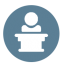 vector icon of a person speaking from behind a podium
