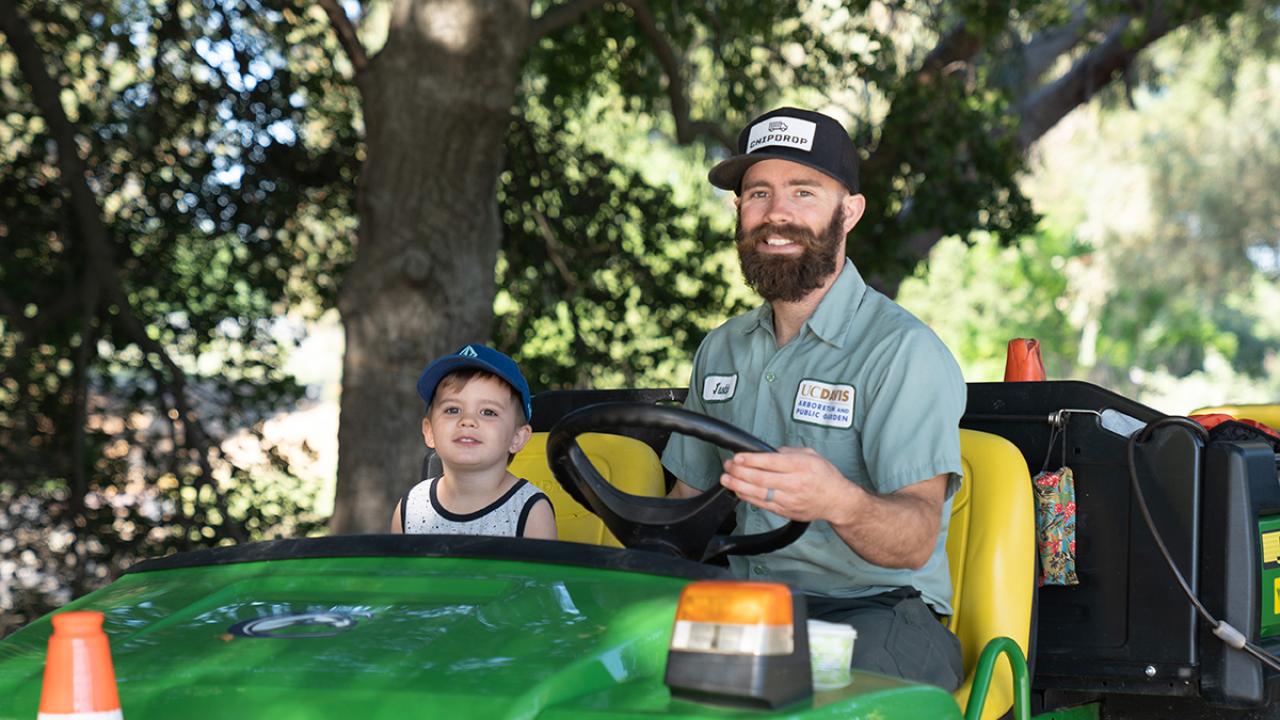 A member of UC Davis' grounds staff with his son during our 2019 Take Your Daughters and Sons to Work (TODS) Day ground staff member and his son at take your daughters and sons to work day uc davis