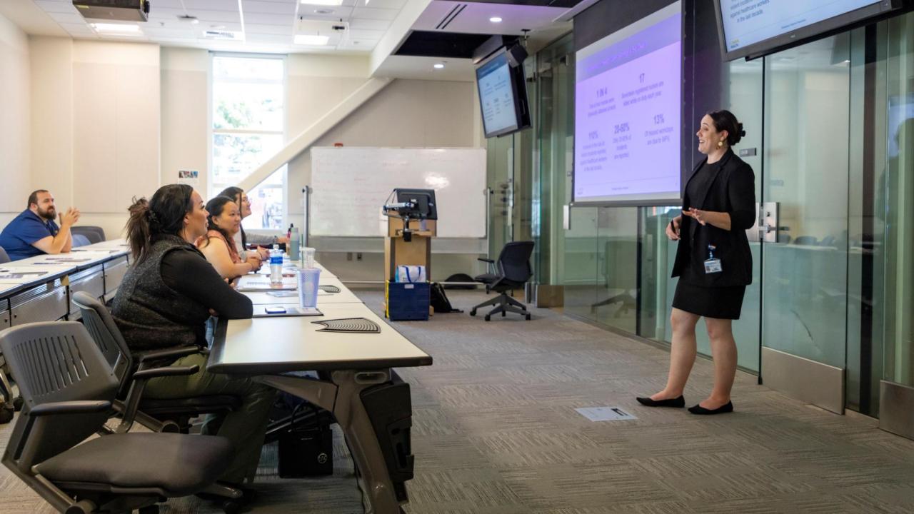 trainer talking in front of audience 