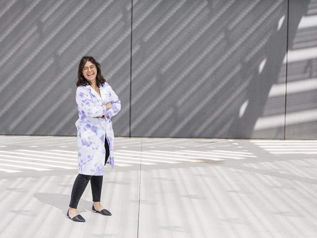 woman smiling outside of the uc davis shrem museum