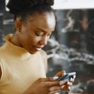 A woman looking at her phone.