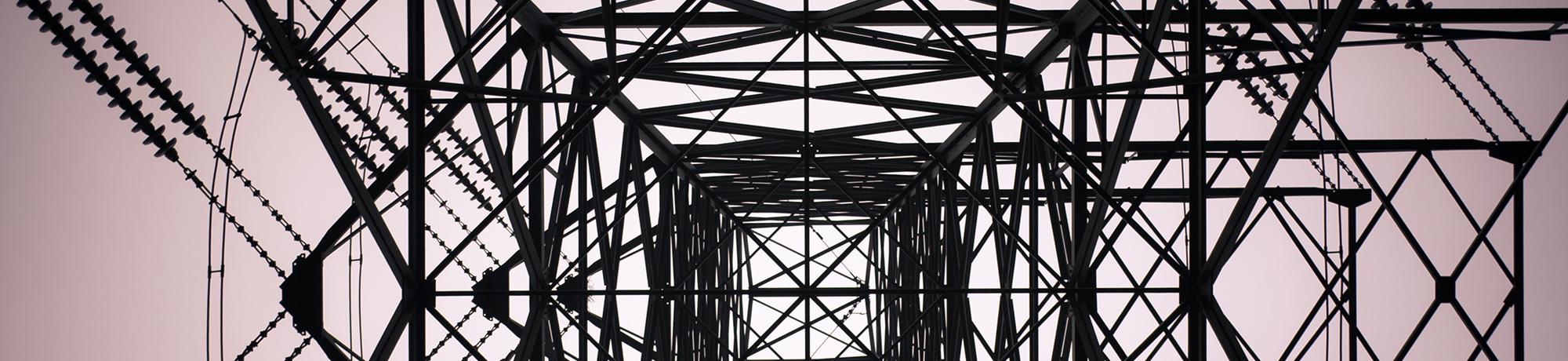 a photograph from underneath a telephone tower